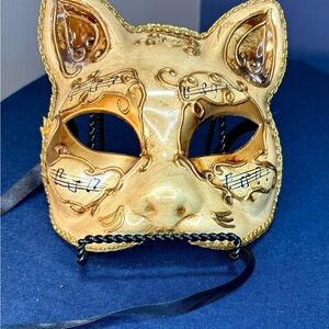 Elegant Gold Cat Mask with Musical Accents